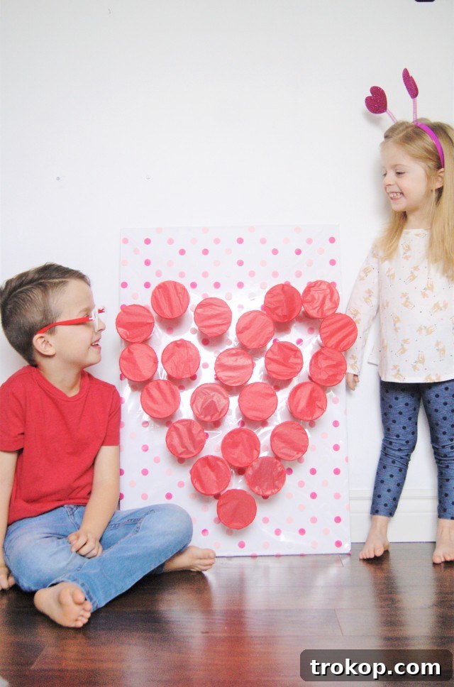 Creative Valentine's Day Party Concepts 26 Valentine DIY “Punch a Prize” Game board with red cups and hidden prizes.