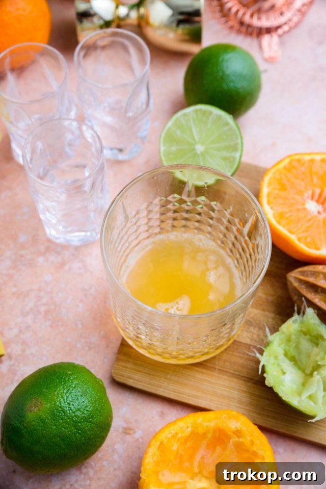 juicing the tangerines and limes for the Cactus cooler shot