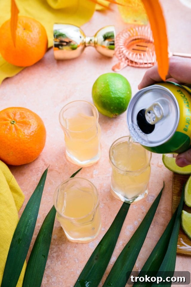Topping up each Cactus cooler with lemon-lime soda