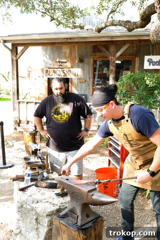Explore New Braunfels: Attractions and Boutiques 17 Blacksmith at Caylor Forge in New Braunfels, demonstrating the craft