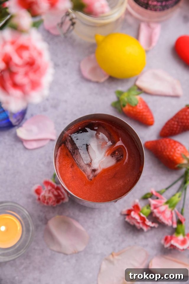 Adding ingredients to a cocktail shaker with ice