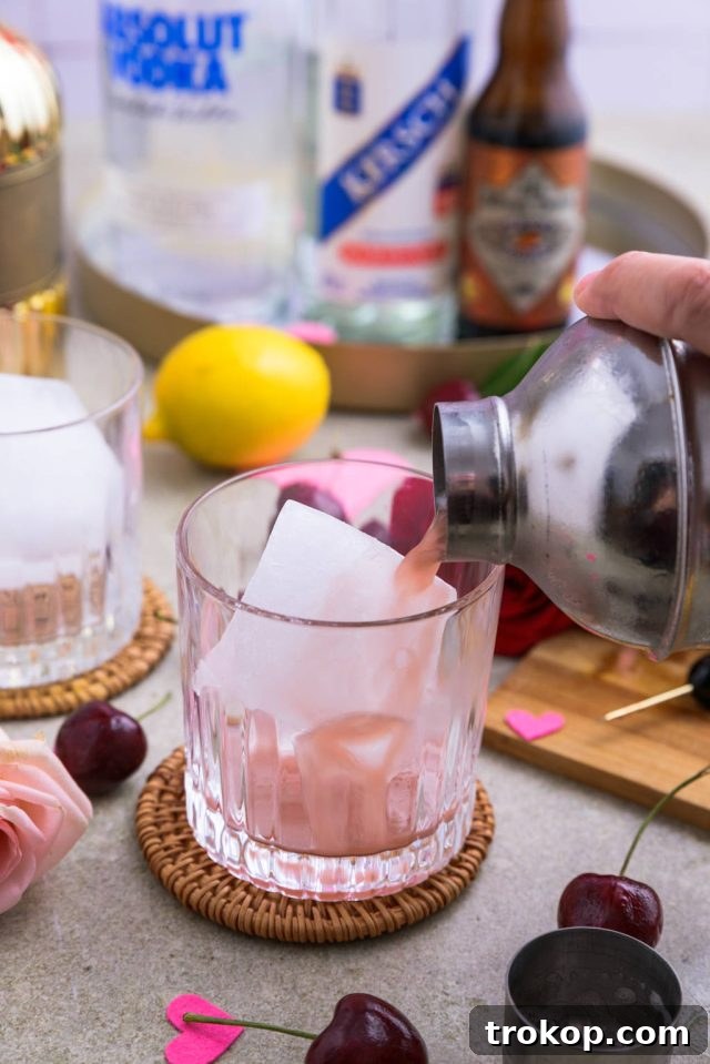 Sweet Cherry Vodka Sour Delight 7 Serving Cherry vodka sour in a whiskey glass