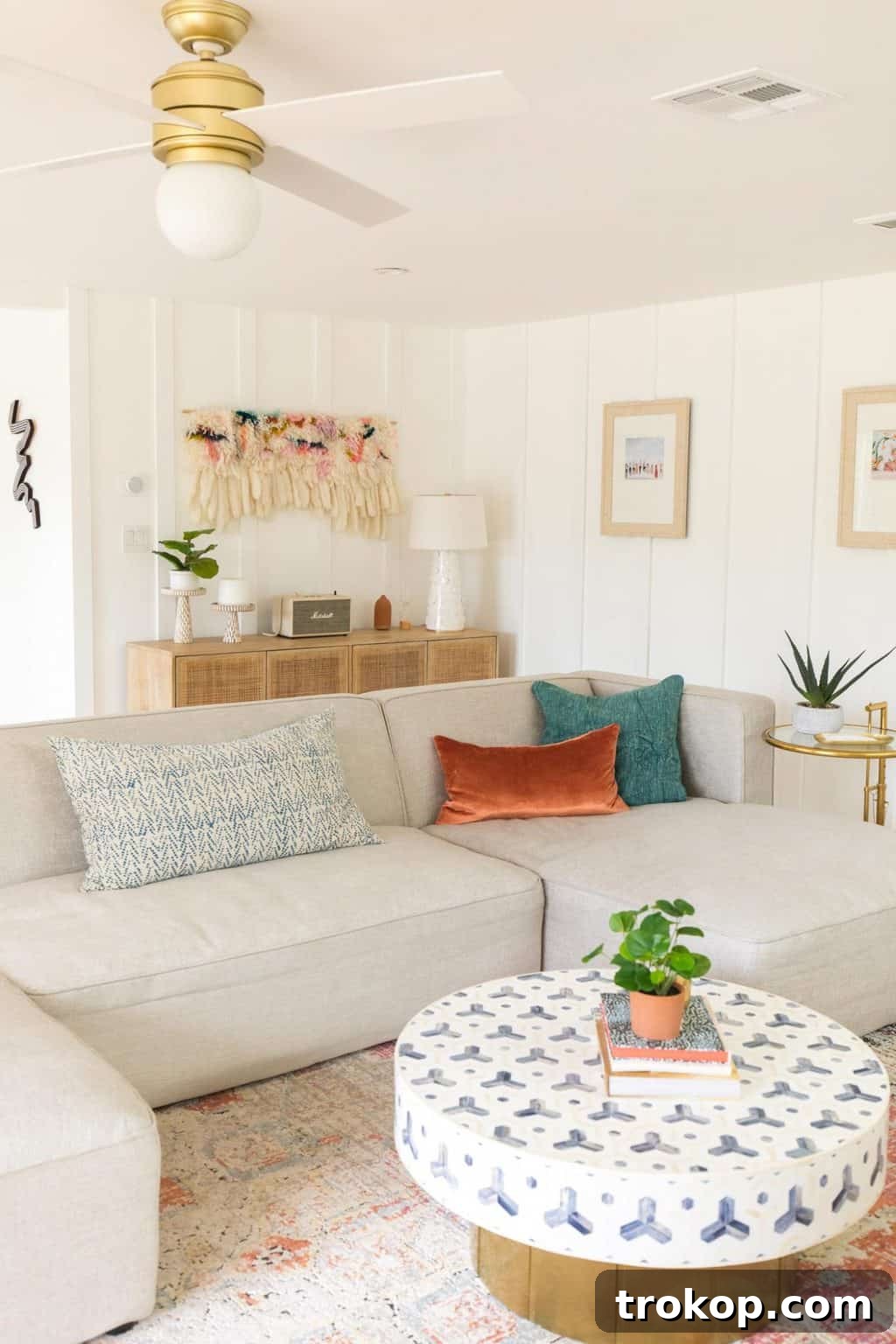 Sectional living room ideas: A cozy sectional sofa styled with an array of throw pillows