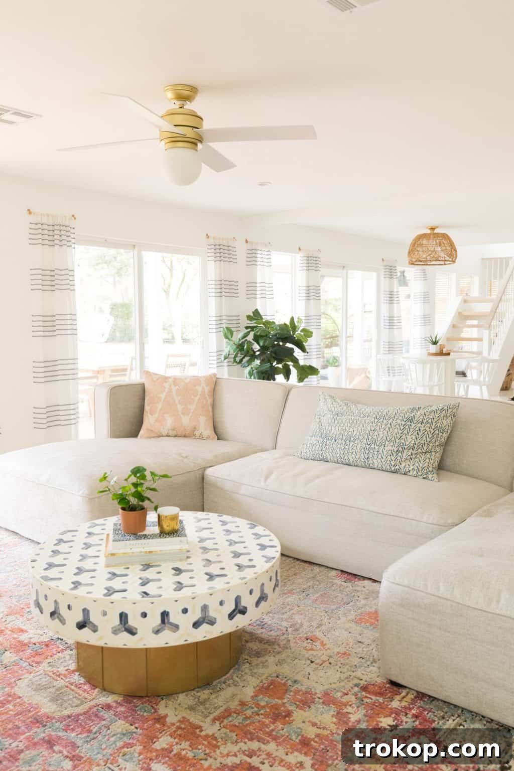 A cozy living room with a beige sectional sofa, creating a warm ambiance
