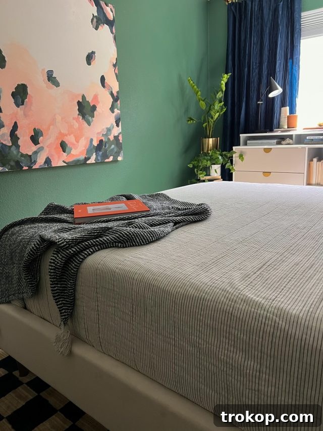 From Workspace to Dream Space The Reveal 11 Custom painted artwork by Sugar & Cloth complements the green office bedroom design, adding a unique touch.