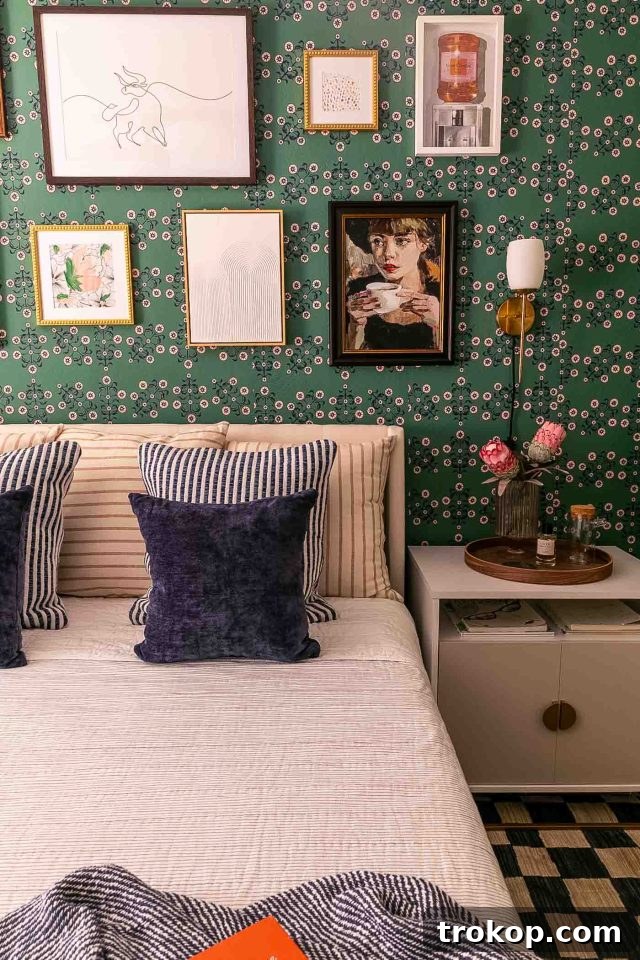 From Workspace to Dream Space The Reveal 4 A fun and whimsical floral and green wallpaper design by Novogratz, used as an accent in the office bedroom.