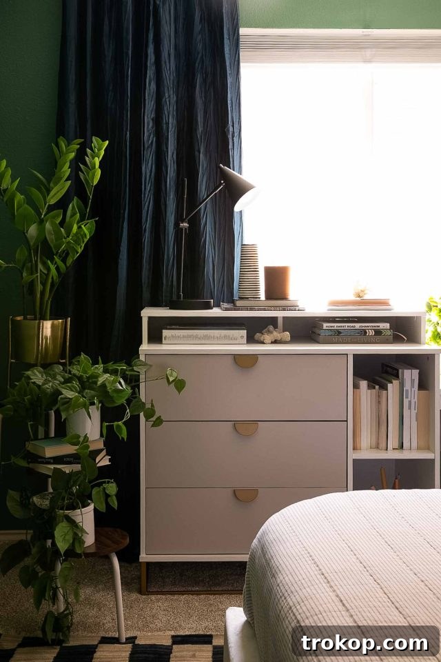 From Workspace to Dream Space The Reveal 8 A multifunctional desk, dresser, and media table from Novogratz, serving multiple purposes in a small office bedroom.