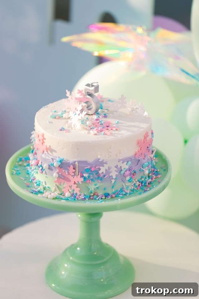 Winter Wonderland Birthday Bash 12 A creative approach to sprucing up a store-bought cake to transform it into a stunning Frozen birthday cake by Sugar & Cloth