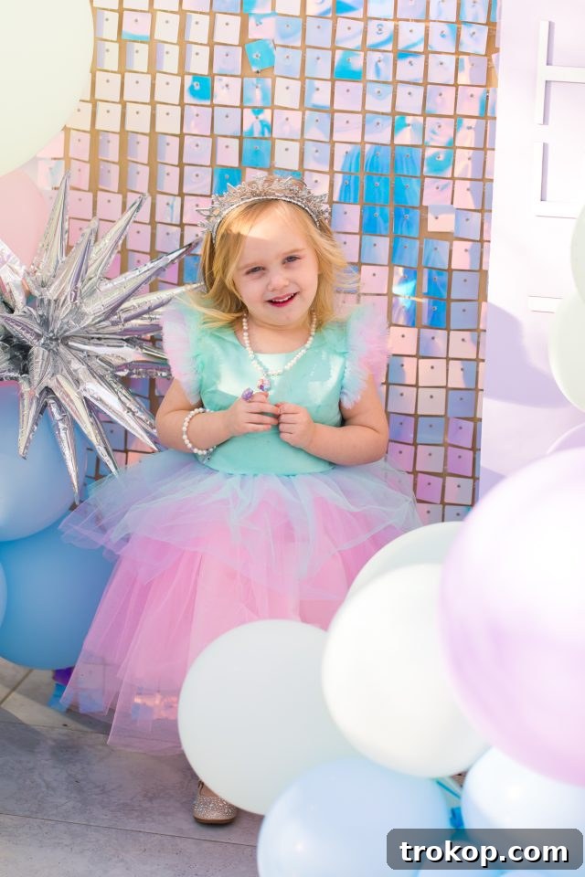 Winter Wonderland Birthday Bash 5 Luca's charming birthday dress idea for an Elsa-inspired birthday outfit by Sugar & Cloth