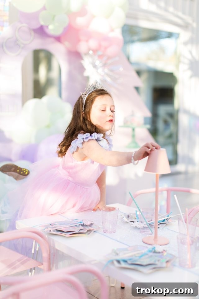 Winter Wonderland Birthday Bash 6 Gwen's elegant Elsa Birthday Dress, perfect for a Frozen-themed celebration