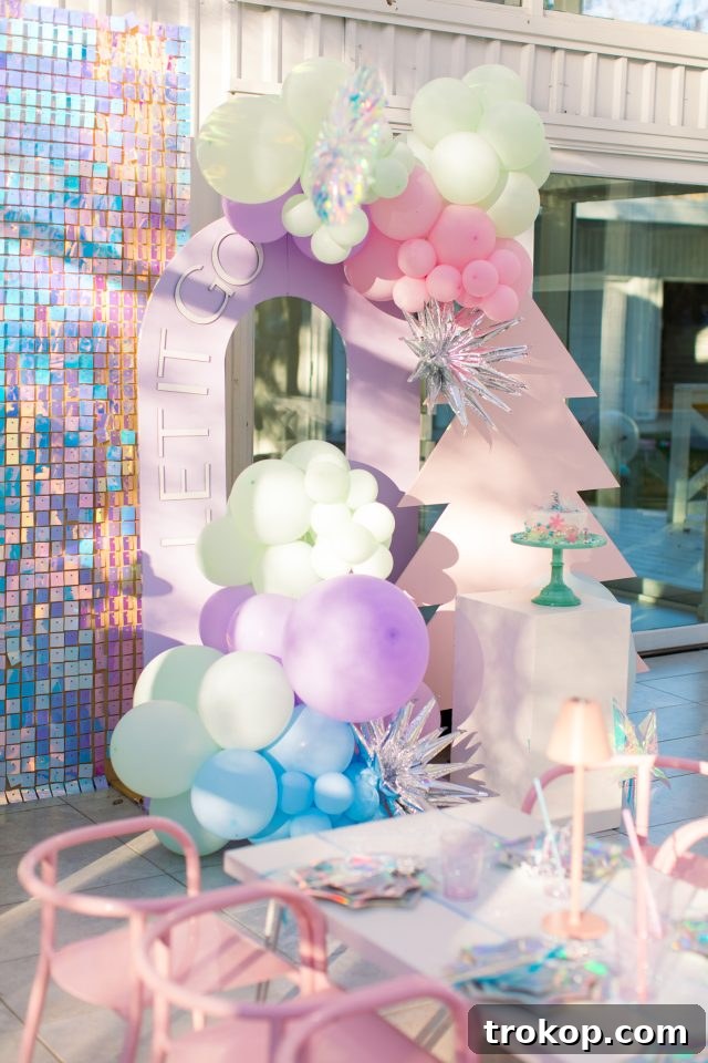 Winter Wonderland Birthday Bash 7 The enchanting Let It Go Frozen Birthday Backdrop by Picnics in the City Houston, creating a magical atmosphere