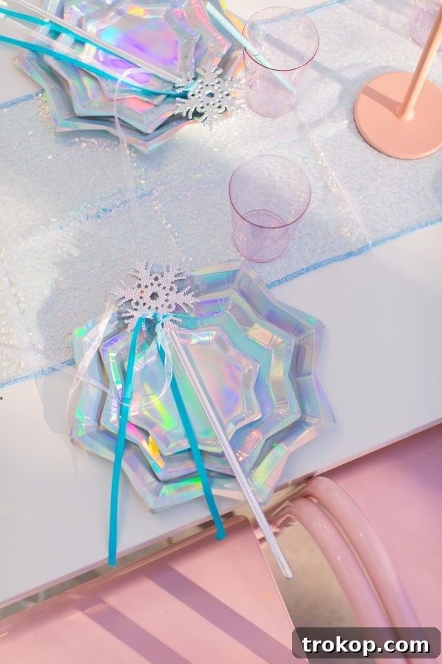 Winter Wonderland Birthday Bash 10 Exquisite snowflake iridescent Frozen birthday table decor for a DIY Frozen Birthday Party by Sugar & Cloth