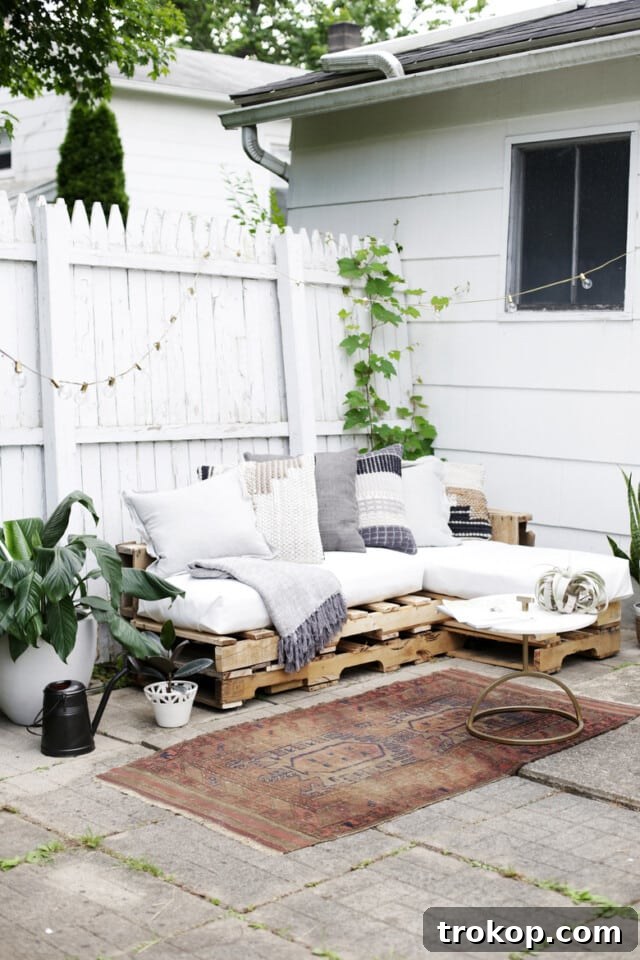 Comfortable outdoor pallet sofa for patio lounging, showcasing a modular design crafted from repurposed pallets