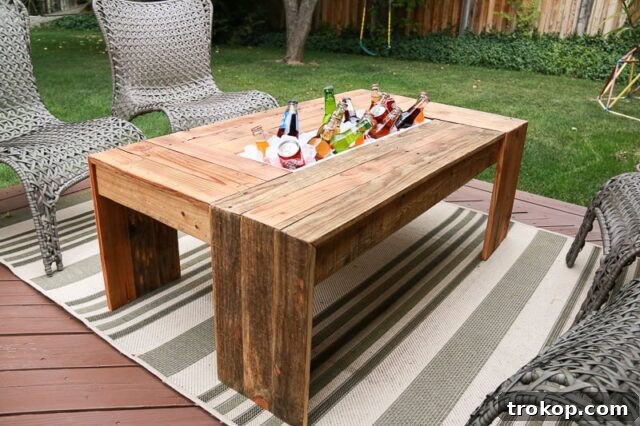 Ingenious outdoor pallet coffee table featuring a built-in drink cooler, perfect for entertaining and showcasing clever DIY pallet ideas