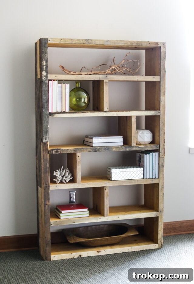 Elegant wood pallet bookshelf designed for efficient organization, showcasing books and decorative items with a rustic, ethereal look