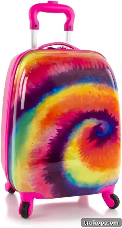 Make Travel a Breeze: 21 Top Kids' Luggage, From Carry-Ons to Ride-Ons 12 Heys Kid's Fashion Spinner Hardside Carry-On Luggage (Tie-Dye) for best luggage for kids