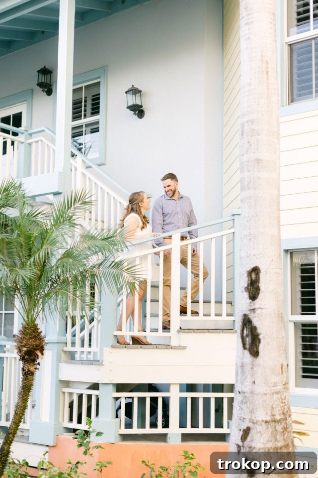 Beaches Turks and Caicos Sunset Vows by the Sea 5 The wedding couple sharing a joyful moment on a resort balcony overlooking the ocean