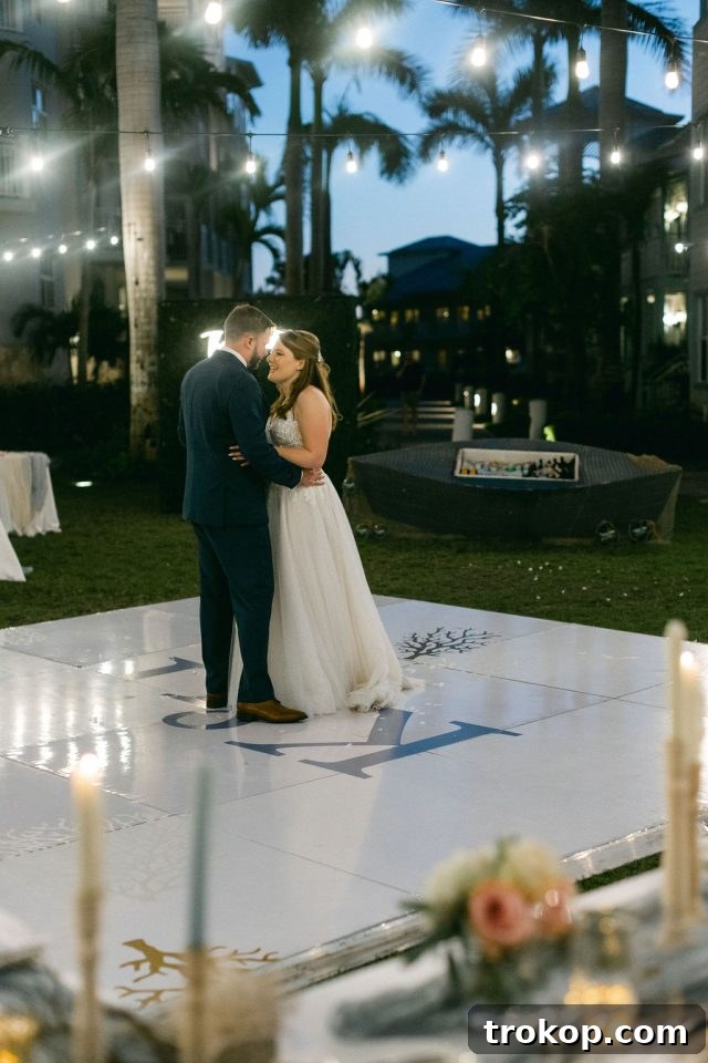 Beaches Turks and Caicos Sunset Vows by the Sea 45 The bride and groom embracing on the dance floor during their spectacular entrance