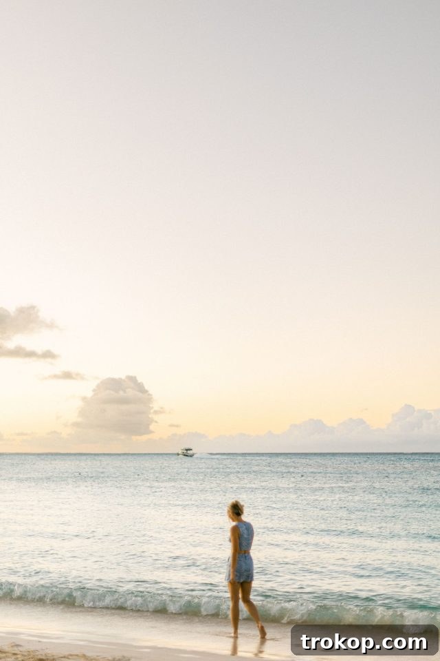 Beaches Turks and Caicos Sunset Vows by the Sea 6 Romantic photo of the bride and groom embracing amidst vibrant tropical greenery
