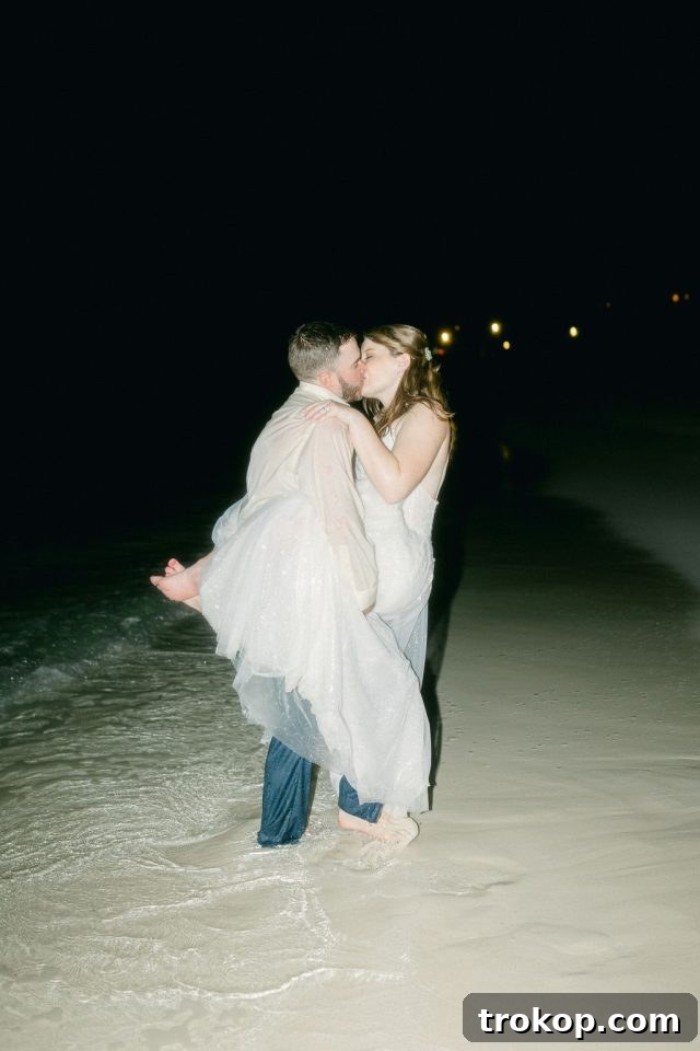 Beaches Turks and Caicos Sunset Vows by the Sea 58 The newlyweds sharing a passionate kiss in the tranquil turquoise waters of Turks and Caicos