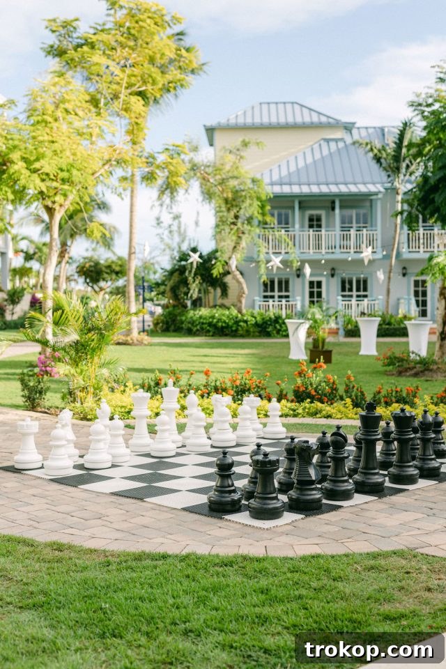 Beaches Turks and Caicos Sunset Vows by the Sea 9 Guests playing a life-size chess game on the lawn at Beaches Key West Village