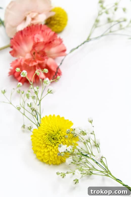 Finished DIY floral headpiece adorned with a variety of flowers and foliage, ready to wear