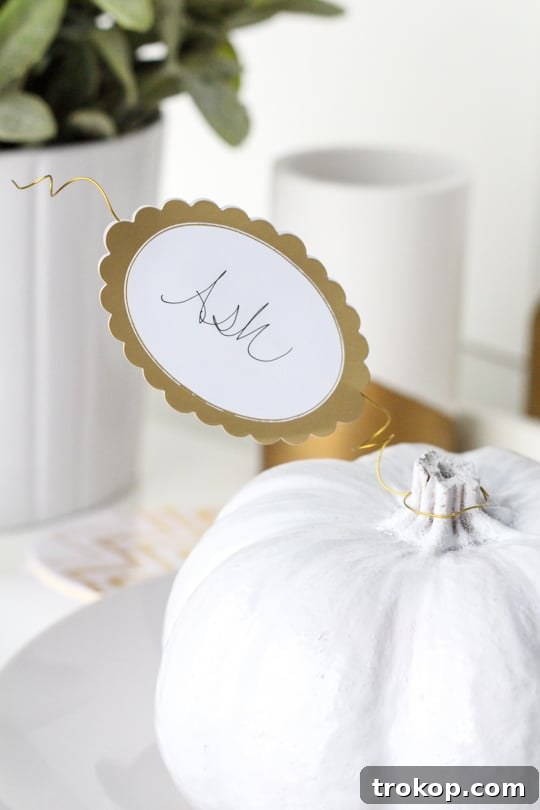 Attaching name labels to wire for pumpkin place cards