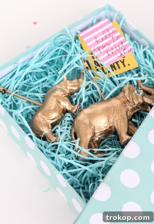 Close-up of a DIY golden animal memo holder with a memo attached, showcasing its quirky yet professional appeal.