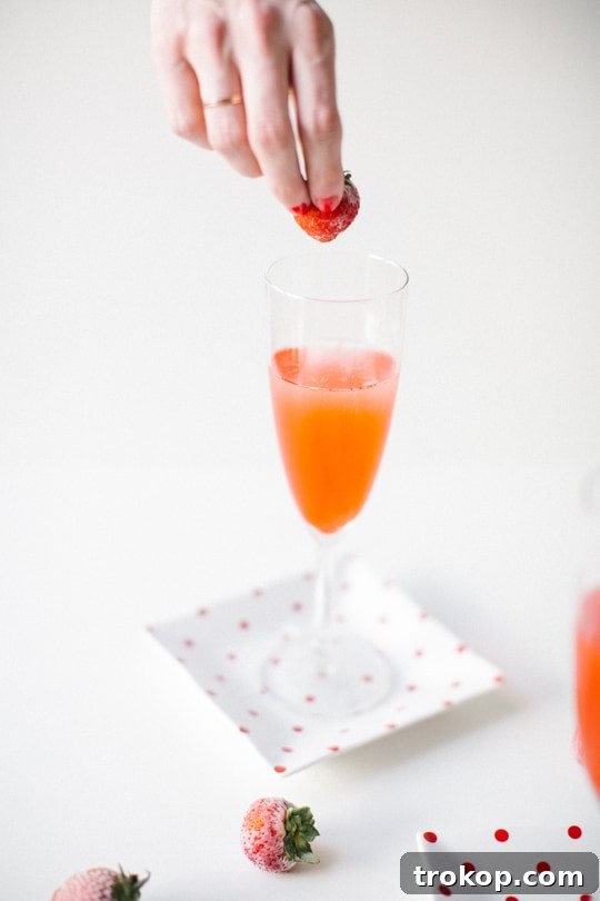 Pouring Red Currant Syrup into a Champagne Flute