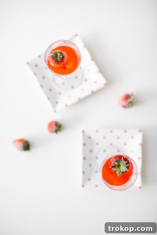 Finished Red Currant Champagne Cocktail with Strawberry