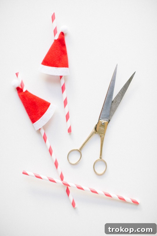 Festive Santa Hat Swizzle Sticks: A DIY Minute Miracle 5 Finished DIY Santa Hat Drink Stirrers in a Festive Drink