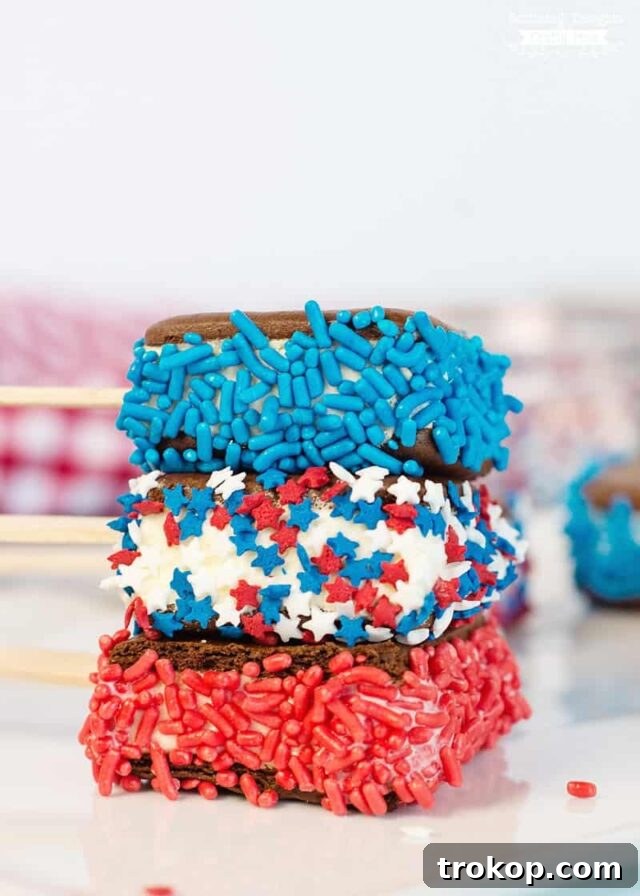 Homemade red, white, and blue ice cream sandwiches with festive sprinkles
