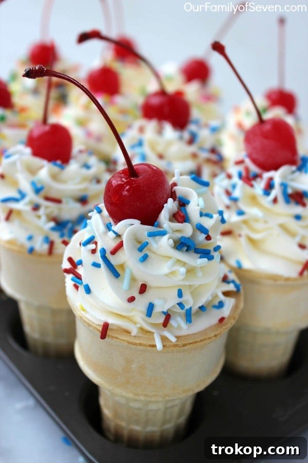 Cupcakes baked inside ice cream cones, topped with frosting and sprinkles