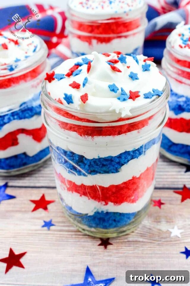 Individual Fourth of July cake in a jar, layered with patriotic colors