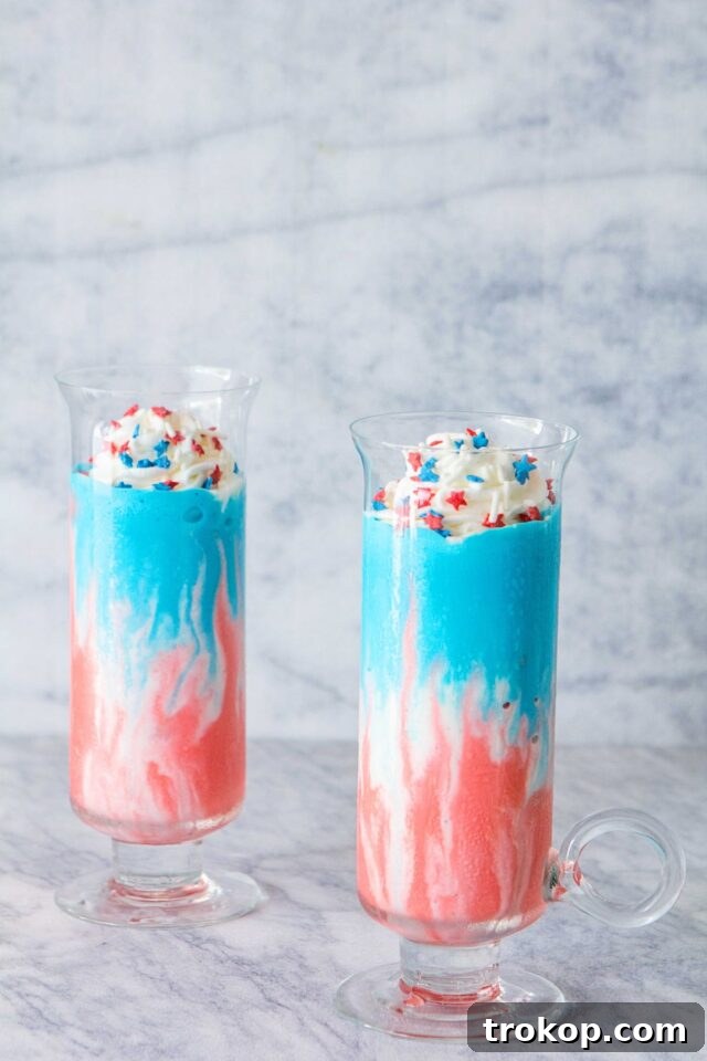 A festive Firecracker Milkshake topped with whipped cream and patriotic candies