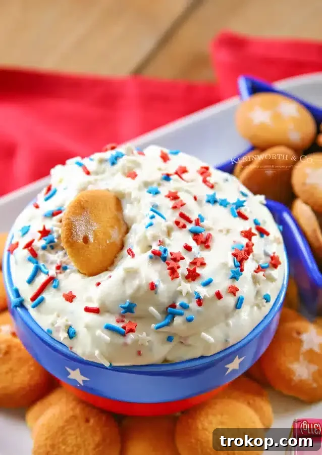 Festive patriotic cake batter dip with red, white, and blue sprinkles