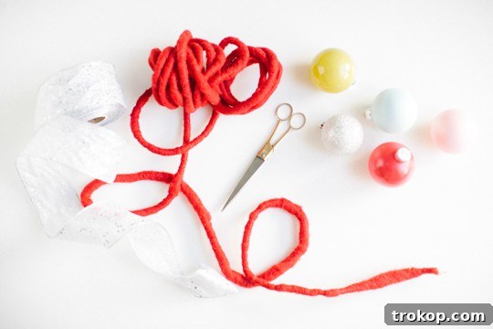 DIY color block ornament garland in progress, showcasing grouped ornaments
