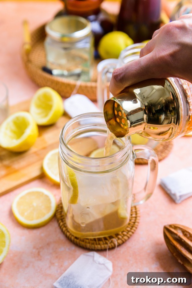 A beautifully prepared Spiked Arnold Palmer cocktail in a tall glass, ready to be enjoyed.