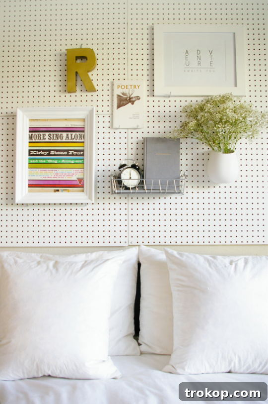 Pegboard Perfection: 26 Creative Ways to Organize and Beautify Every Room 3 DIY pegboard headboard with personalized decor