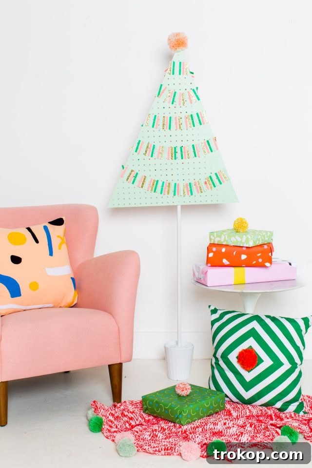 Pegboard Perfection: 26 Creative Ways to Organize and Beautify Every Room 8 A DIY Pegboard Christmas Tree by DIY Blogger Ashley Rose of Sugar & Cloth with colorful ornaments