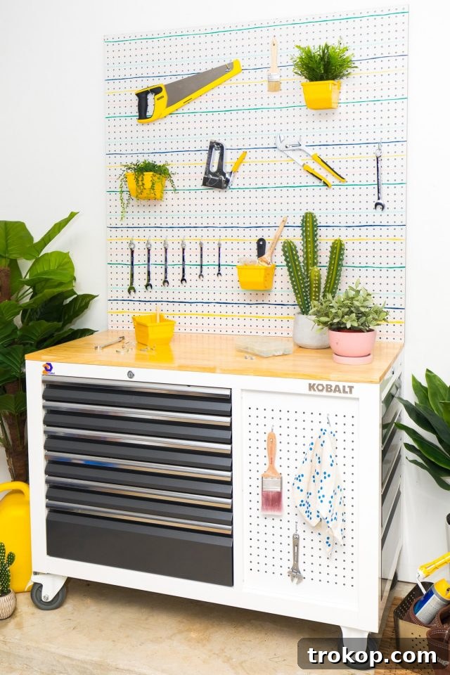 Pegboard Perfection: 26 Creative Ways to Organize and Beautify Every Room 5 Photo of a She Shed Tool Organizer with neatly arranged tools on a striped pegboard