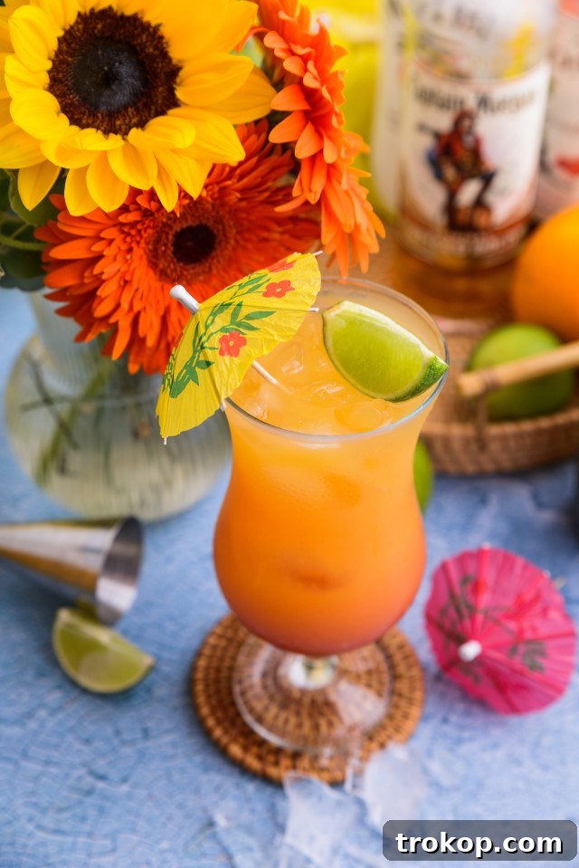 Sunshine in a Glass Bahama Mama Recipe 9 A vibrant Bahama Mama cocktail, a tropical rum-based drink, garnished and ready to be served.