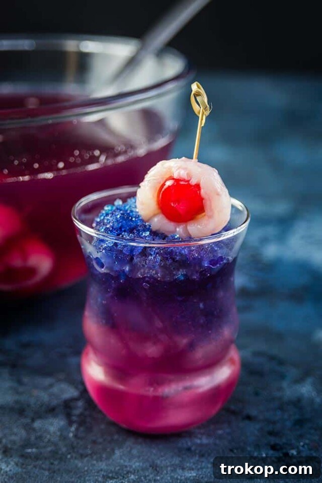 Potions & Poisons: Halloween's Sinister Sips 16 Purple People Eater Halloween cocktail that changes color