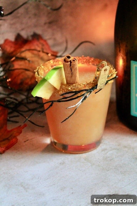 Potions & Poisons: Halloween's Sinister Sips 18 Sparkling Spiced Pear Fireball Whiskey cocktail for autumn