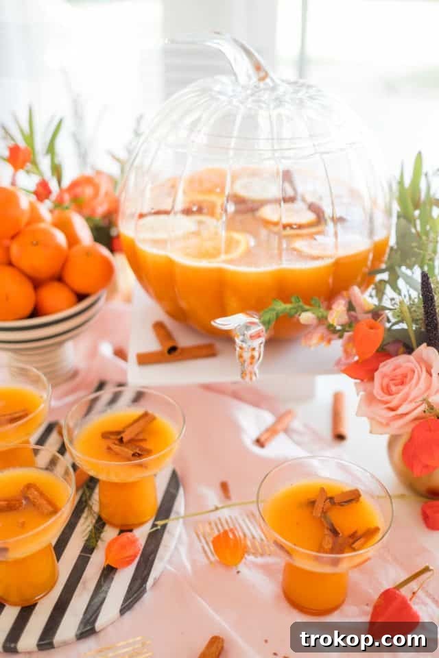 Terrifying Tipples for a Spooktacular Halloween 24 photo of a thanksgiving punch in a pumpkin punch bowl