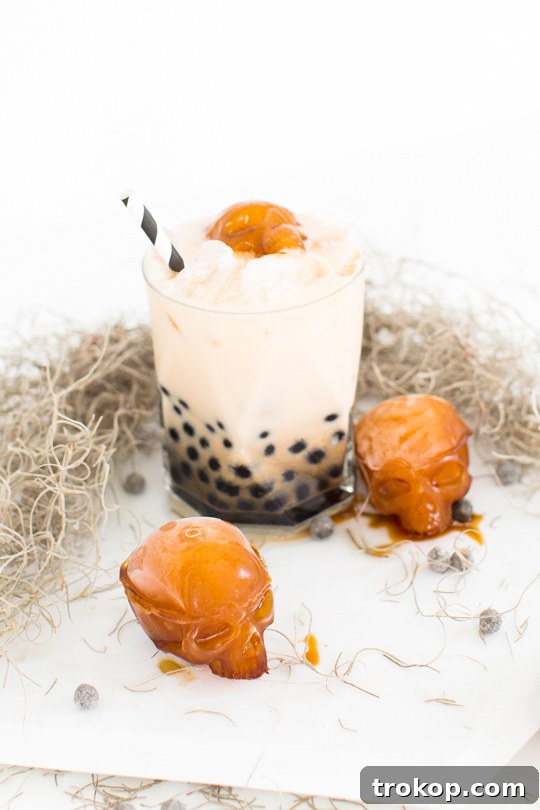 Potions & Poisons: Halloween's Sinister Sips 33 Bubbly Spiked Dirty Chai Latte Cocktail with skeleton ice molds