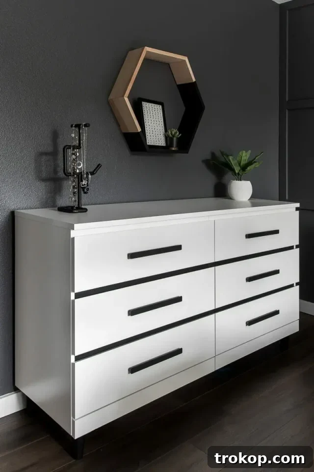 IKEA Malm dresser with modern black and white stick and peel vinyl design