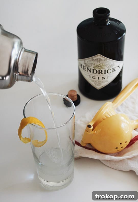 Detailed French 75 cocktail recipe card with ingredients and instructions.