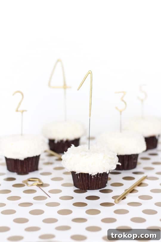 DIY Countdown Cupcakes - A close up shot showing cupcakes decorated with numbered sparkler candles.