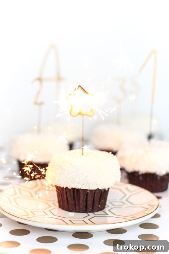DIY Countdown Cupcakes - A close-up of a lit sparkler on a cupcake, creating a magical atmosphere.